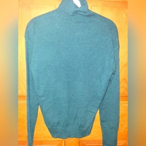 Green turtleneck sweater
